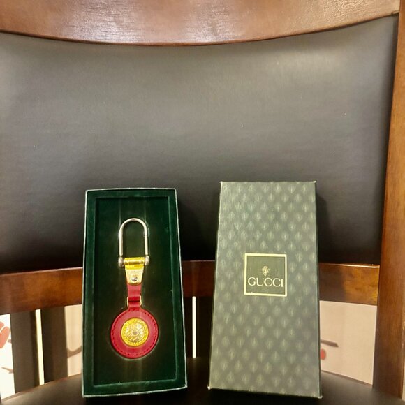 Gucci Accessories - Vintage Gucci leather and gold-plated keychain,  from the 1980s.